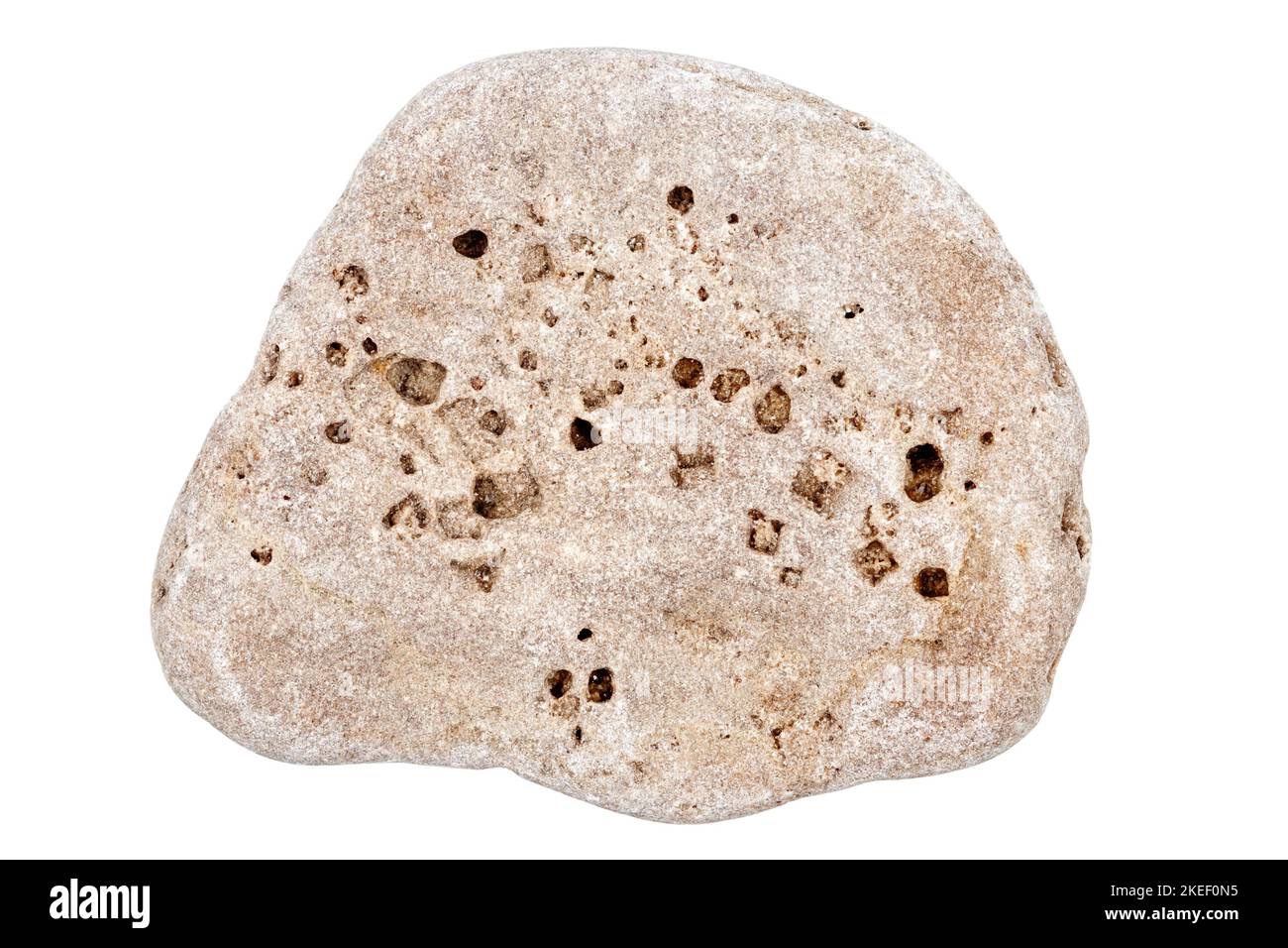 Top view of single beige pebble isolated on white background. Stock Photo