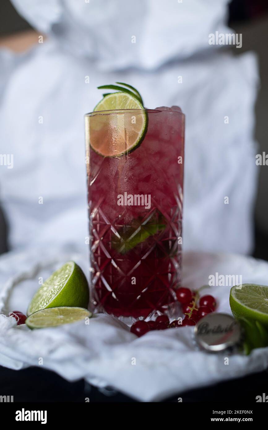 Red cocktail glass with passion fruit and vodka, flavored with lavender