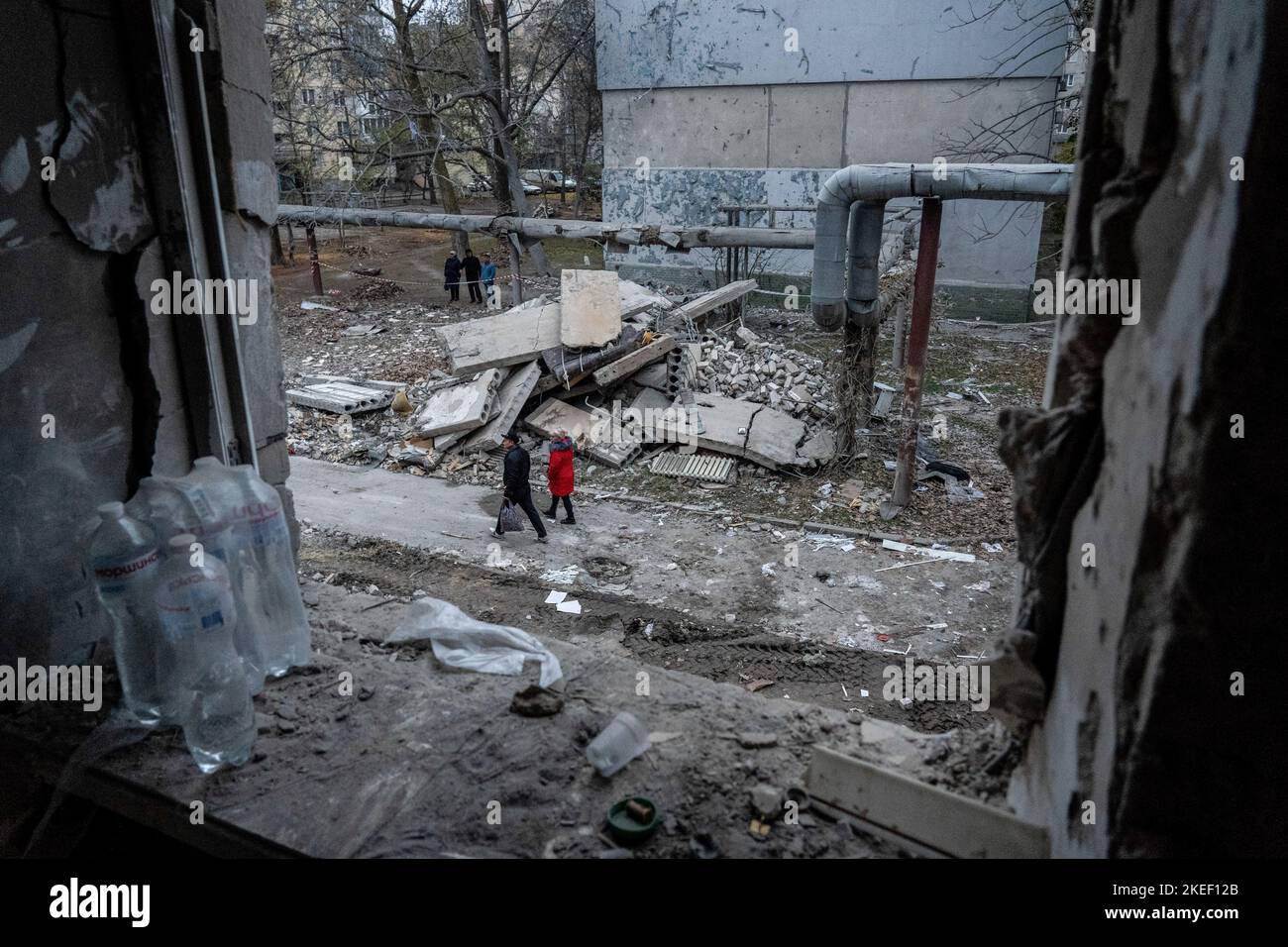 Mykolaiv, Ukraine. 11th Nov, 2022. Residents were seen walking outside the damaged residential building. A Russian missile attack on a residential building in the Inhulskyi district of Mykolaiv, a southern city in Ukraine. The deadly attack killed at least 7. Mykolaiv is a city 50 km away from Kherson city, where the Ukrainian force has gained a huge battlefield success in the past couple of days. (Photo by Ashley Chan/SOPA Images/Sipa USA) Credit: Sipa USA/Alamy Live News Stock Photo