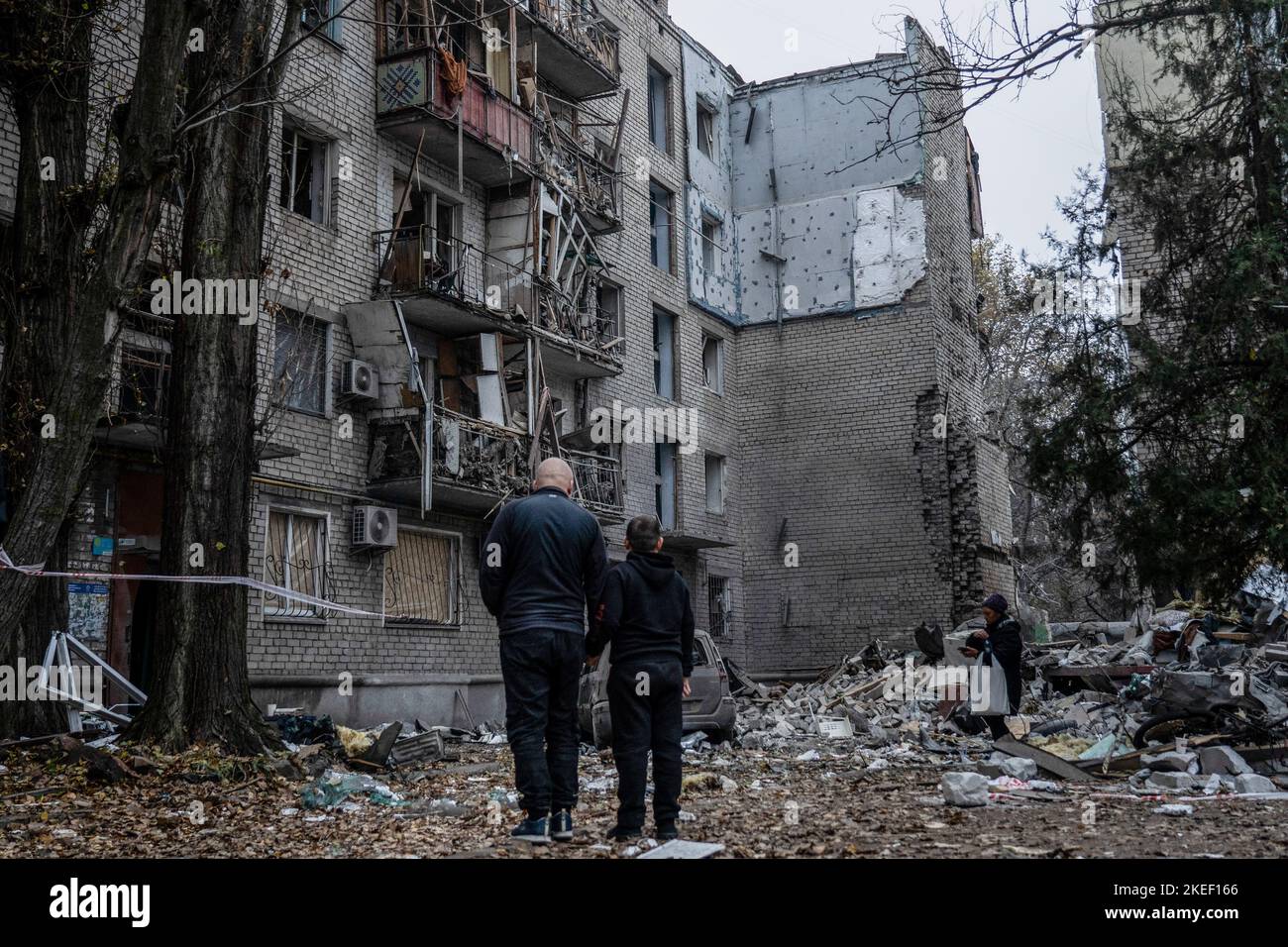 Mykolaiv, Ukraine. 11th Nov, 2022. Residents were seen staring at the rubble after the attack. A Russian missile attack on a residential building in the Inhulskyi district of Mykolaiv, a southern city in Ukraine. The deadly attack killed at least 7. Mykolaiv is a city 50 km away from Kherson city, where the Ukrainian force has gained a huge battlefield success in the past couple of days. (Photo by Ashley Chan/SOPA Images/Sipa USA) Credit: Sipa USA/Alamy Live News Stock Photo