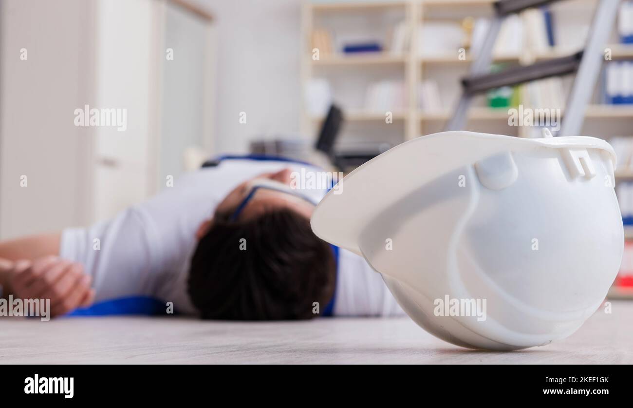 The worker after falling from height - unsafe behavior Stock Photo