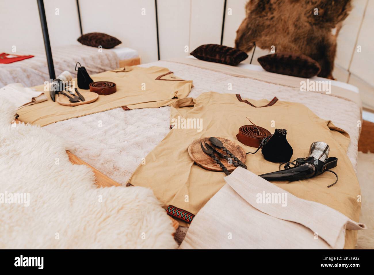 Hunten Robe The interior of a rustic-style tent with hunting equipment and ...