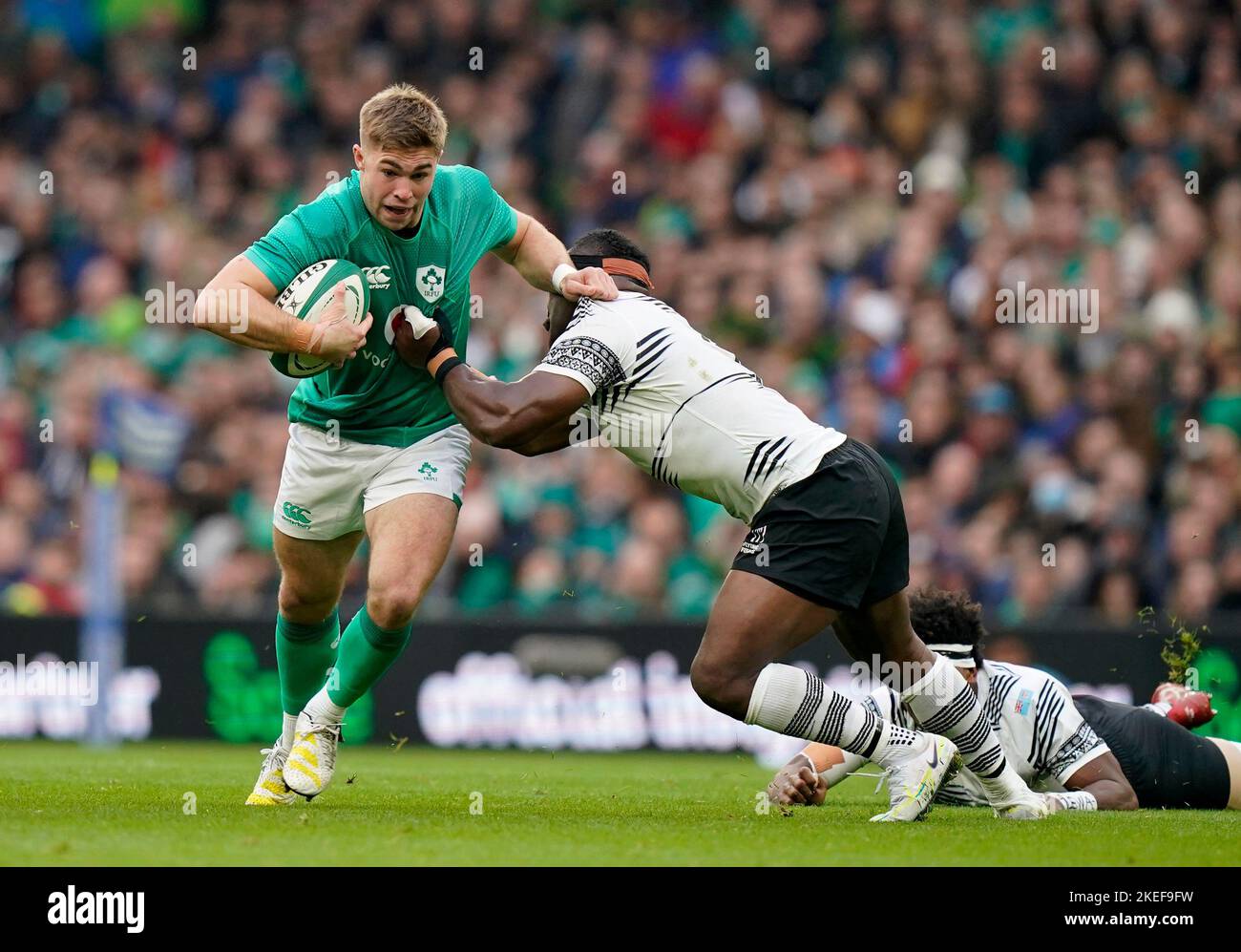 Ireland's Jack Crowley (left) is tackled by Fiji's Levani Botia during the Autumn International match at the Aviva Stadium in Dublin, Ireland. Picture date: Saturday November 12, 2022. Stock Photo