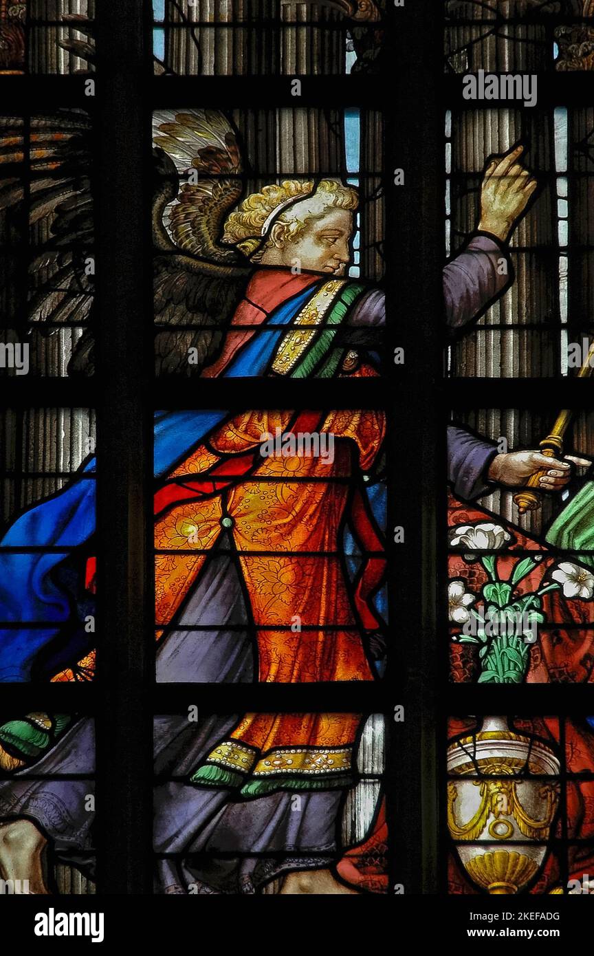 The Archangel Gabriel announces to the Virgin Mary that she will conceive a son named Jesus by the power of the Holy Spirit: detail of 1555 stained glass, designed by Lambert van Noort and made by Digman Meynaert, in the Lady Chapel of the mainly-14th century Oude Kerk or Old Church in Ouderkerksplein, Amsterdam, Netherlands. Stock Photo