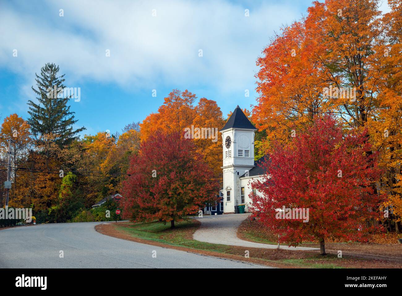 Small town church surrounded by colorful fall foliage, East Kingston