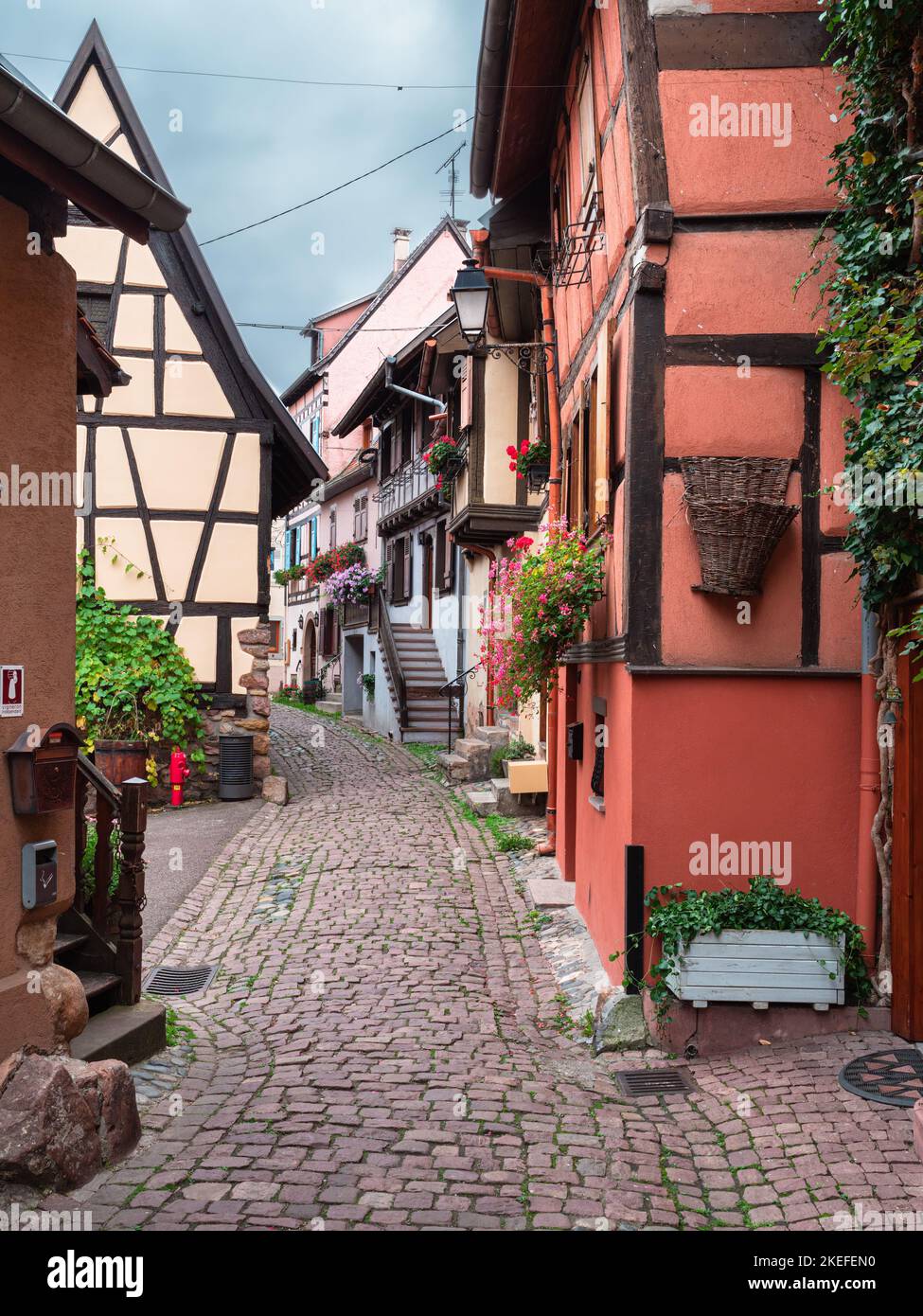 Eguisheim, France - October 12, 2022: Traditional medieval houses in Eguisheim in Alsace along the wine road Stock Photo
