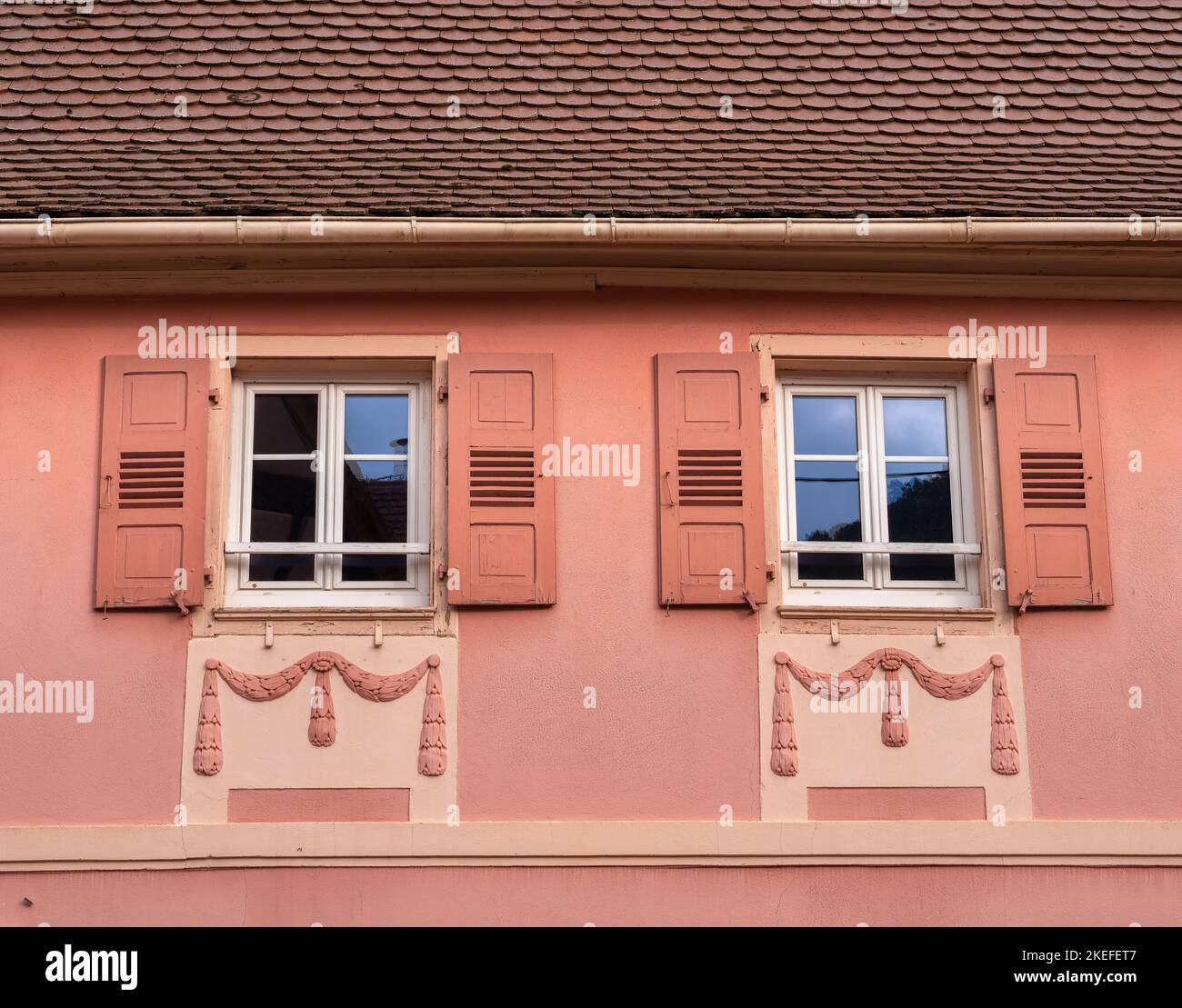 Decorated facade of an old house in Gueberschwihr in Alsace, France Stock Photo