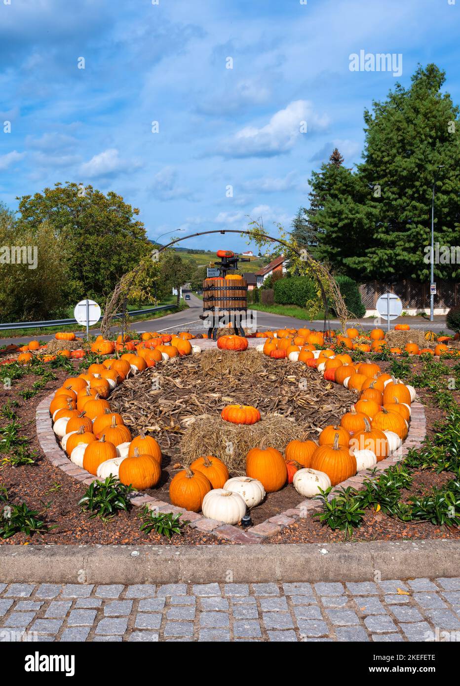 Hartmannswiller, France - October 10, 2022: A roundabout decoration in Hartmannswiller, Alsace, France, decorated with pumpkins and a grape press Stock Photo