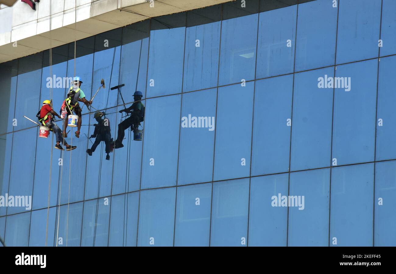 Guwahati, Guwahati, India. 12th Nov, 2022. Workers cleaning the glasses