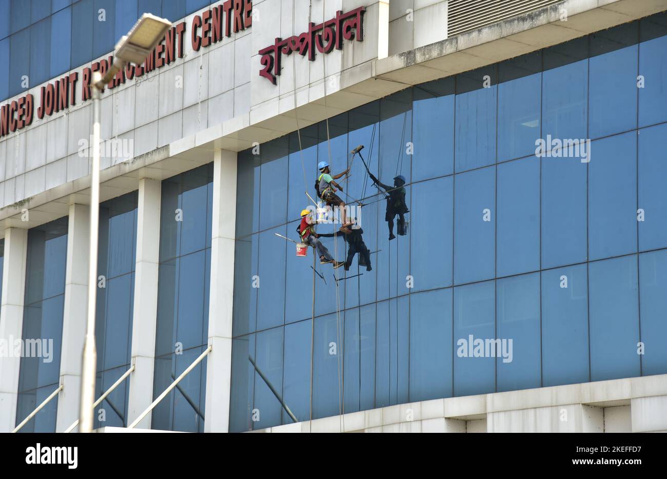 Guwahati, Guwahati, India. 12th Nov, 2022. Workers cleaning the glasses