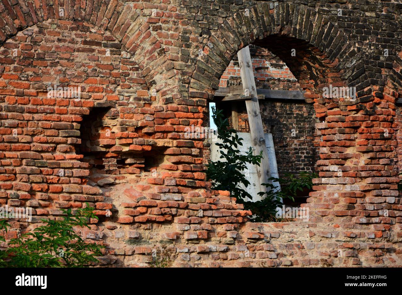 brick wall with window arch, brick house ruins, picture in picture, ruined brick wall with windows Stock Photo