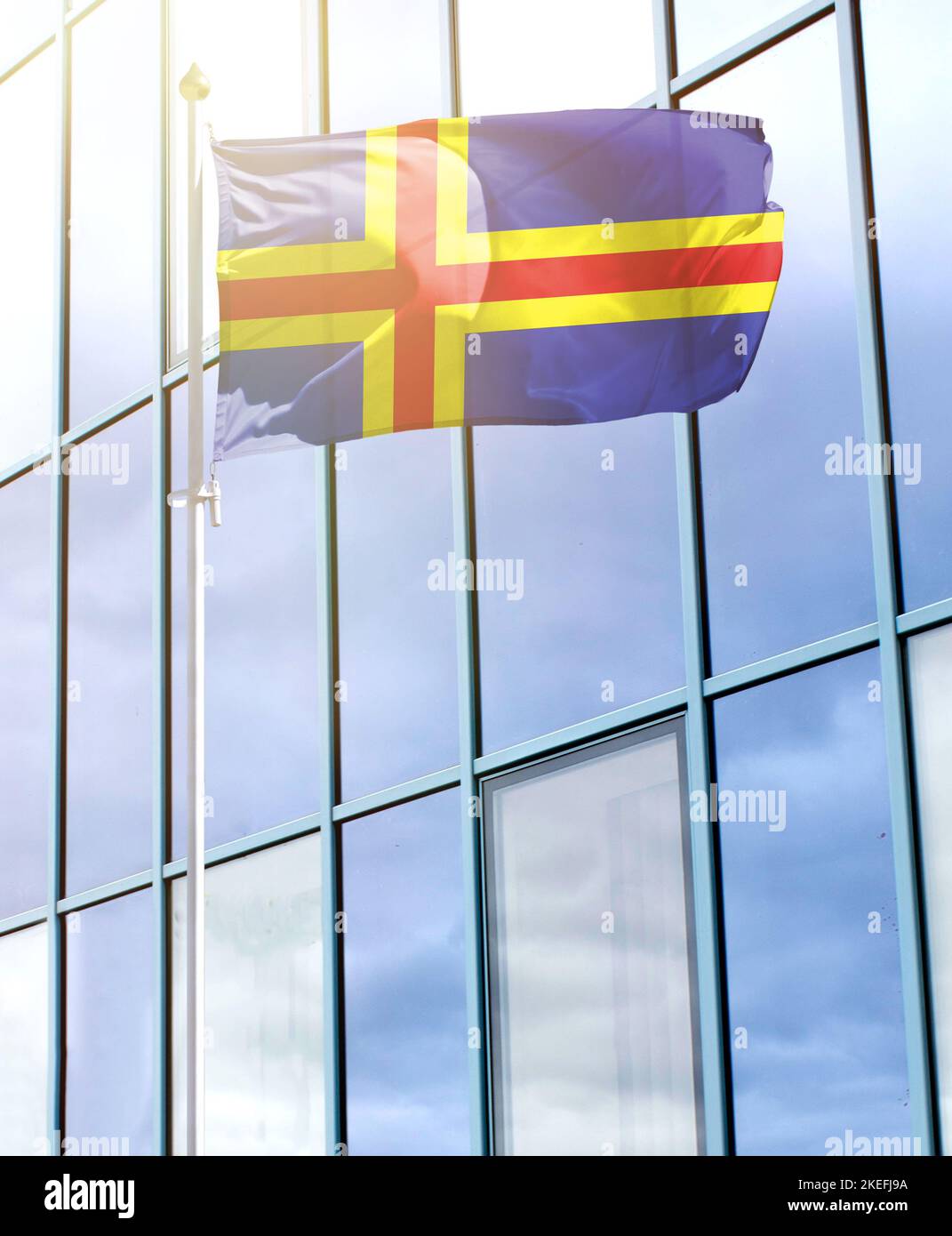 Flag of Aland on a flagpole Stock Photo - Alamy