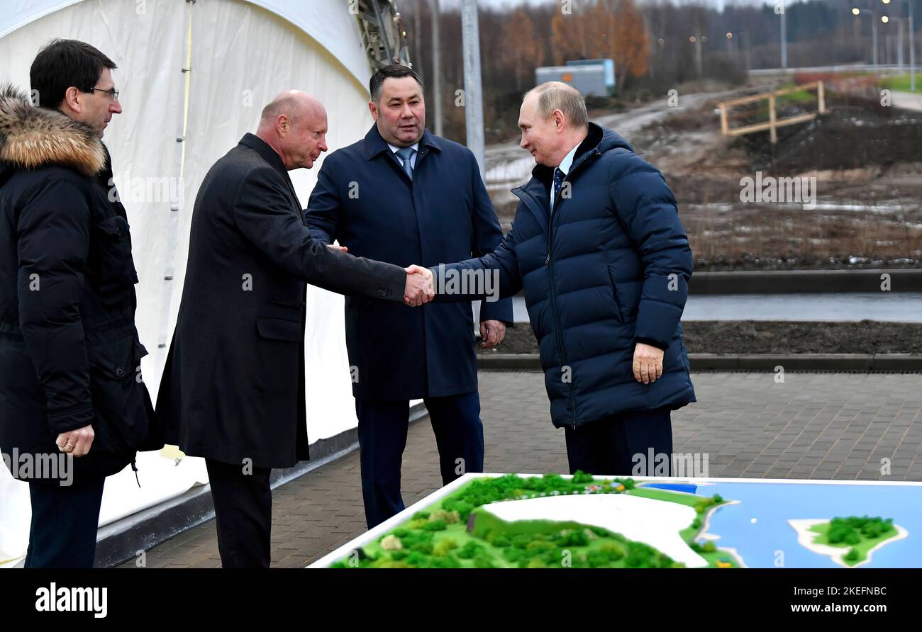 Vladimir Putin examines the site and models of construction projects at the Volzhskoye More tourist and recreation cluster. With Presidential Plenipotentiary Envoy to the Central Federal District Igor Shchegolev (left), Tver Region Governor Igor Rudenya and Vasta Discovery General Director Sergei Bachin.Photo:Russia President's Office Stock Photo