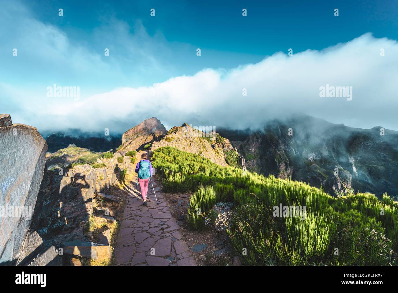Description Woman Hiking Along Scenic Hike Trail To Pico Ruivo In The description-woman-hiking-along-scenic-hike-trail-to-pico-ruivo-in-the
