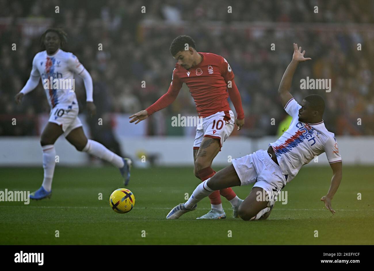 Nottingham, Nottinghamshire, UK. 12th Nov, 2022. Cheick Doucouré (Crystal Palace) tackles Morgan Gibbs-White (Nottingham Forest) during the Nottingham Forest V Crystal Palace Premier League match at the City Ground, Nottingham, UK. Credit: MARTIN DALTON/Alamy Live News Stock Photo