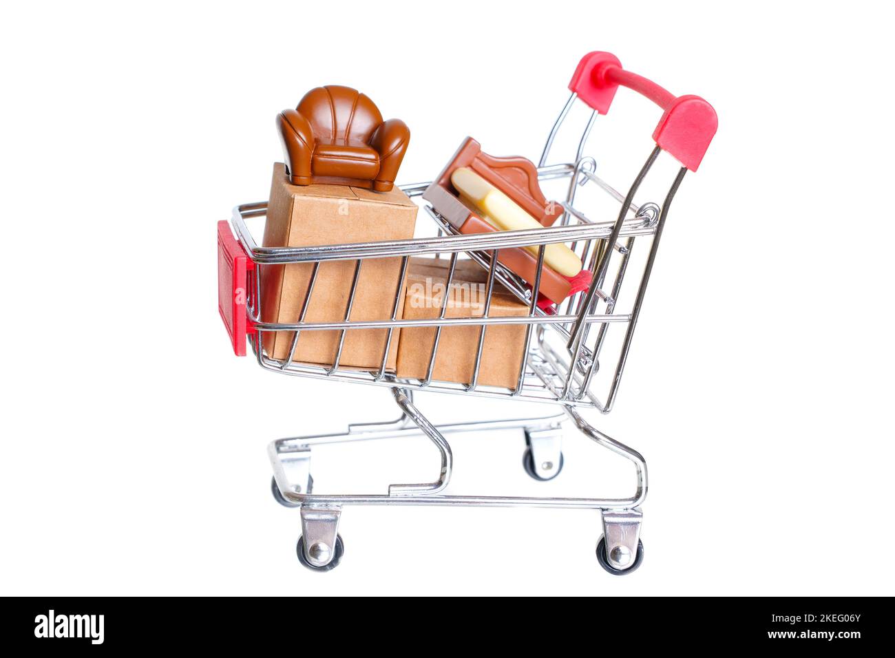 Miniature furniture figurines and shipping boxes in a small push cart