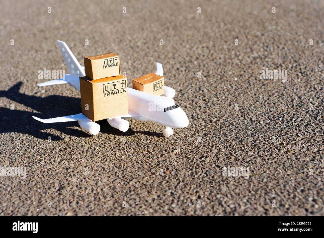 Toy aircraft and tiny delivery boxes marked with shipping symbols