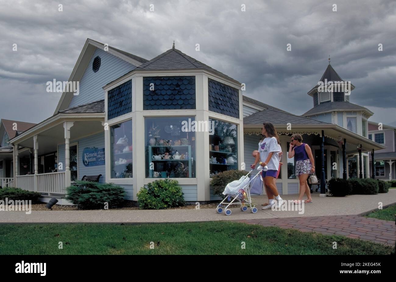 Vacationers shop boutiques in the Lake Of The Ozarks shopping district in Missouri. Stock Photo