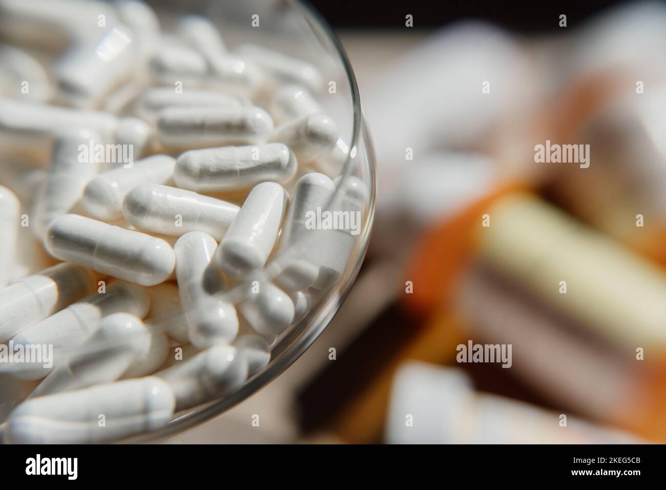 Tablets, capsules, antibiotics. Disease prevention. Treatment for colds and flu. Coronavirus. Receptor drugs. White and green pills. Stock Photo