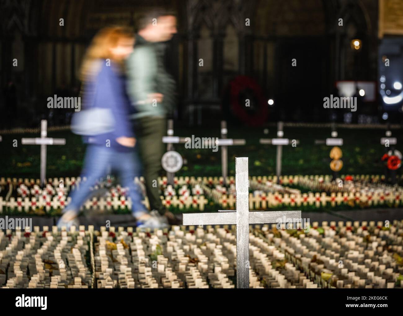 London, UK. 12th Nov, 2022. Small wooden crosses mark those who lost their lives, as people walk past to pay their respects. The Field of Remembrance at Westminster Abbey has been organised by The Poppy Factory since 1928 to honour and remember those who lost their lives while serving in the Armed Forces. The Field of Remembrance will be open to the public until Nov 20th. Credit: Imageplotter/Alamy Live News Stock Photo