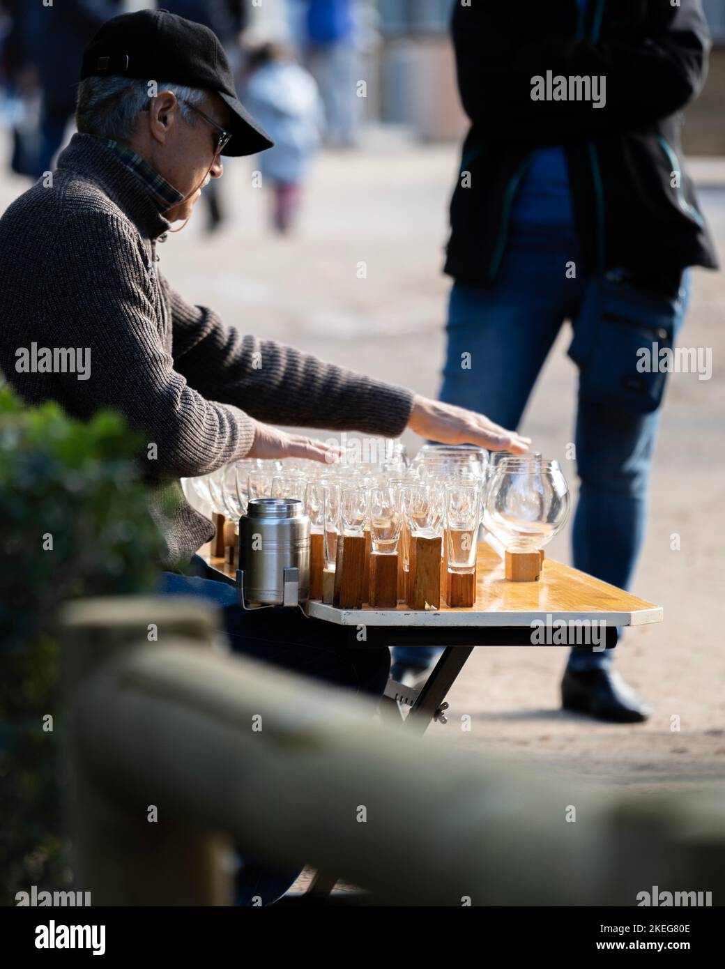 Street musician playing on a wine glass harp in Madrid , Spain Stock Photo Alamy