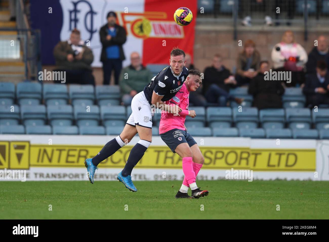 Dundee, Scotland, UK. 12th November 2022;  Dens Park, Dundee, Scotland: Scottish Championship football, Dundee versus Raith Rovers; Lee Ashcroft of Dundee heads clear from Kyle Connell of Raith Rovers Credit: Action Plus Sports Images/Alamy Live News Stock Photo