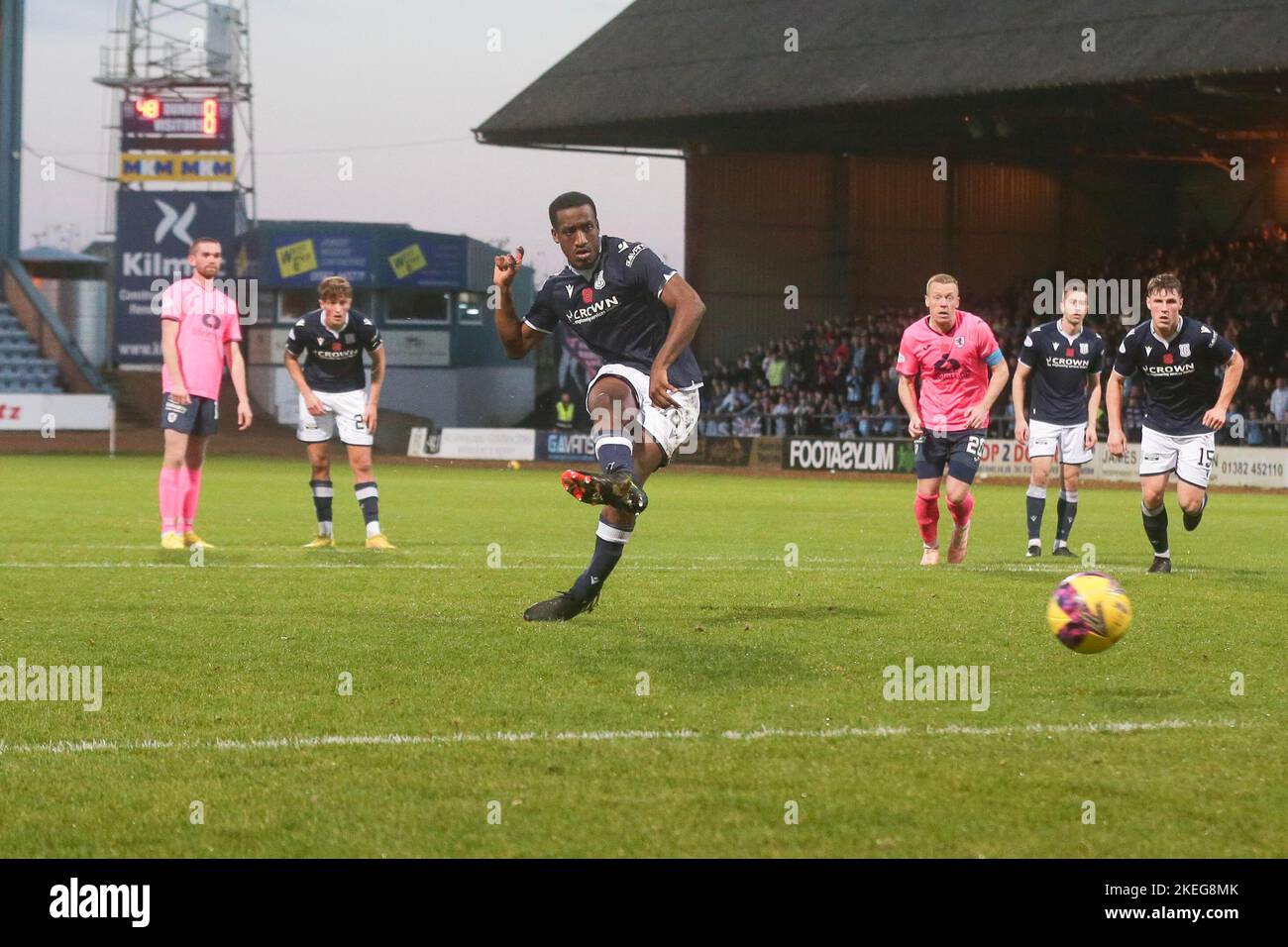 Dundee, Scotland, UK. 12th November 2022;  Dens Park, Dundee, Scotland: Scottish Championship football, Dundee versus Raith Rovers; Zach Robinson of Dundee scores the opening goal to put his side 1-0 ahead from the penalty spot in the 49th minute Credit: Action Plus Sports Images/Alamy Live News Stock Photo
