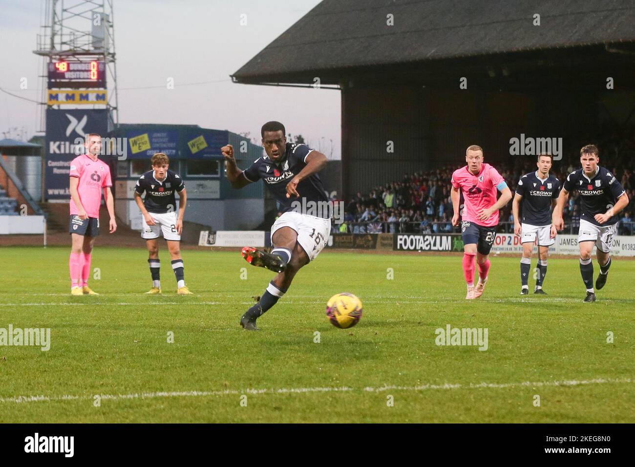 Dundee, Scotland, UK. 12th November 2022;  Dens Park, Dundee, Scotland: Scottish Championship football, Dundee versus Raith Rovers; Zach Robinson of Dundee scores the opening goal to put his side 1-0 ahead from the penalty spot in the 49th minute Credit: Action Plus Sports Images/Alamy Live News Stock Photo