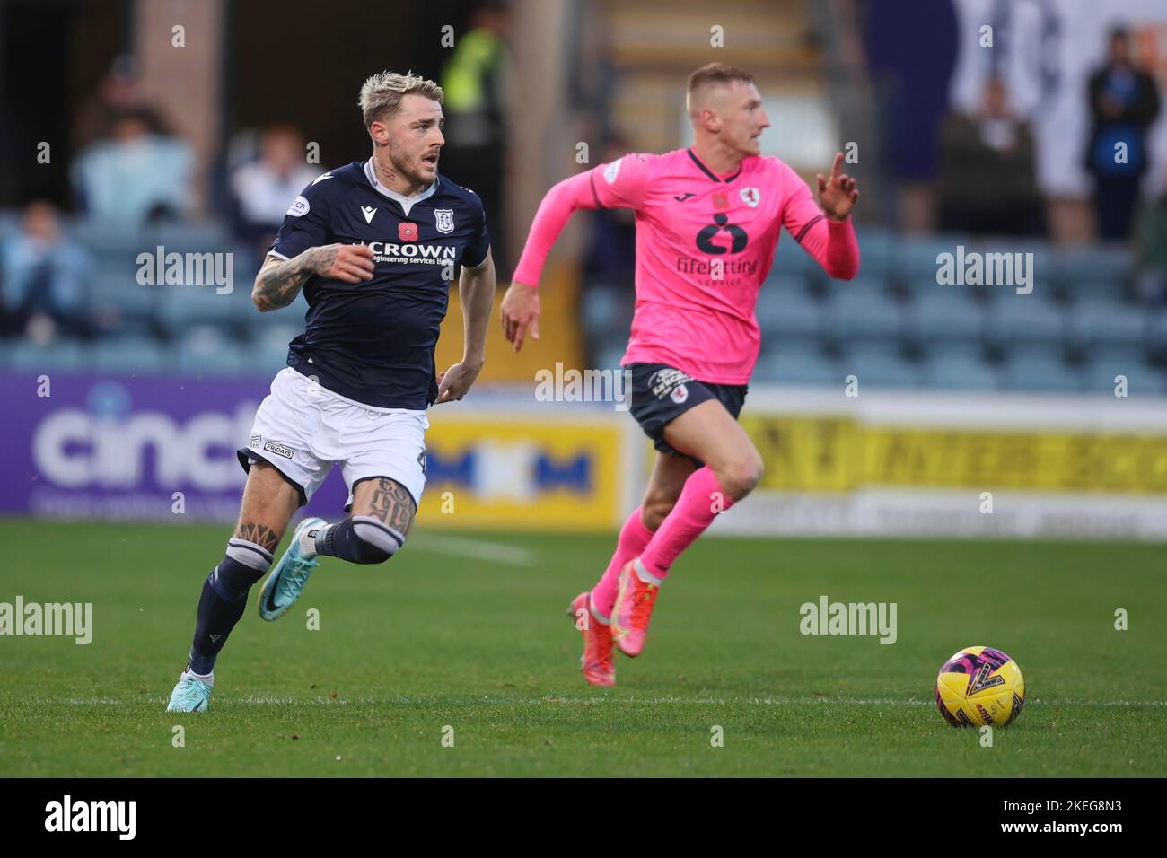 Dundee, Scotland, UK. 12th November 2022;  Dens Park, Dundee, Scotland: Scottish Championship football, Dundee versus Raith Rovers; Tyler French of Dundee races away from Scott Brown of Raith Rovers Credit: Action Plus Sports Images/Alamy Live News Stock Photo
