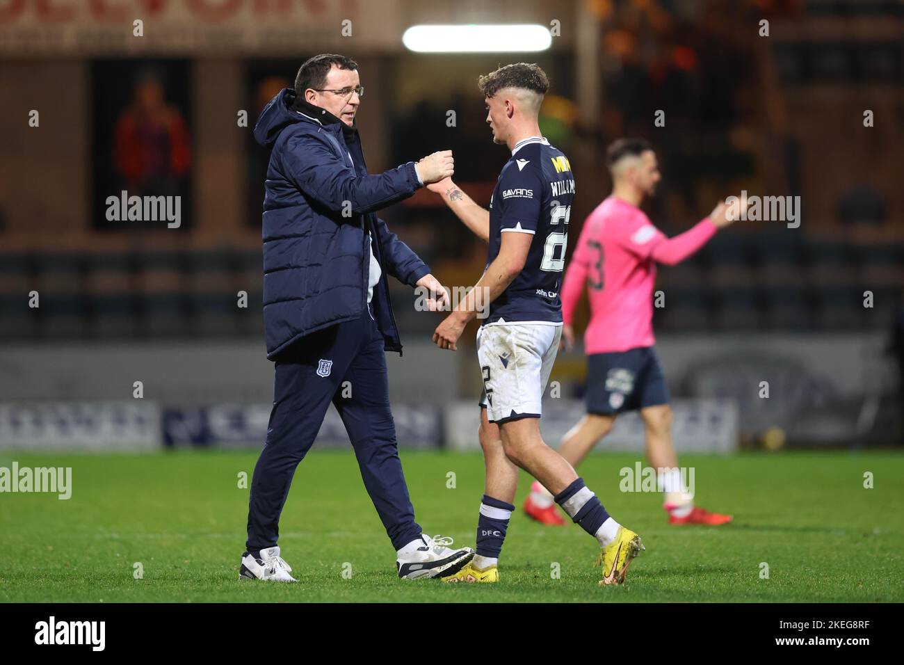 Dundee, Scotland, UK. 12th November 2022; Dens Park, Dundee, Scotland: Scottish Championship football, Dundee versus Raith Rovers; Dundee manager Gary Bowyer celebrates at the end of the match with Ben Williamson Credit: Action Plus Sports Images/Alamy Live News Stock Photo
