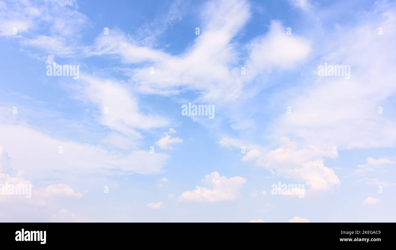 Bright blue sky with light clouds - background, panoramic cloudscape Stock Photo