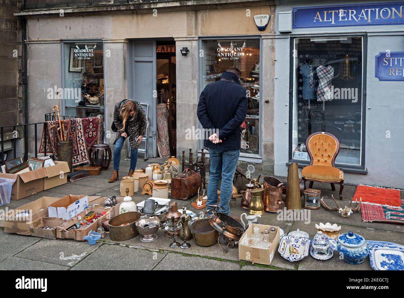 Young couple browsing outside an antique shop on Dundas Street in Edinburgh's New Town. Stock Photo