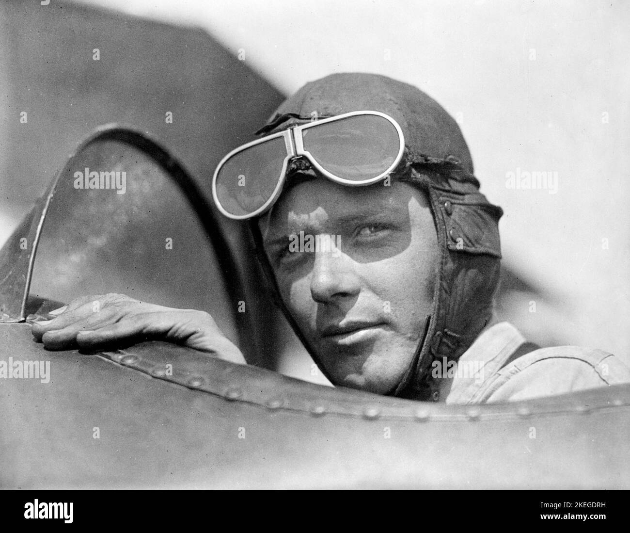 Charles Lindbergh, wearing helmet with goggles up, in open cockpit of airplane at Lambert Field, St. Louis, Missouri 1923 Stock Photo