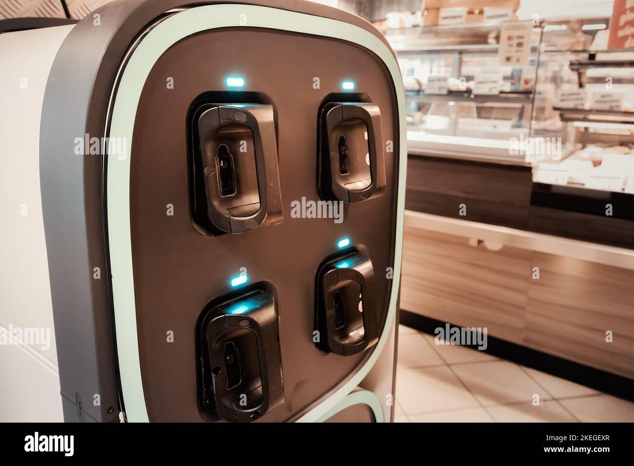 Electric scooter battery swap and charging station in supermarket Stock