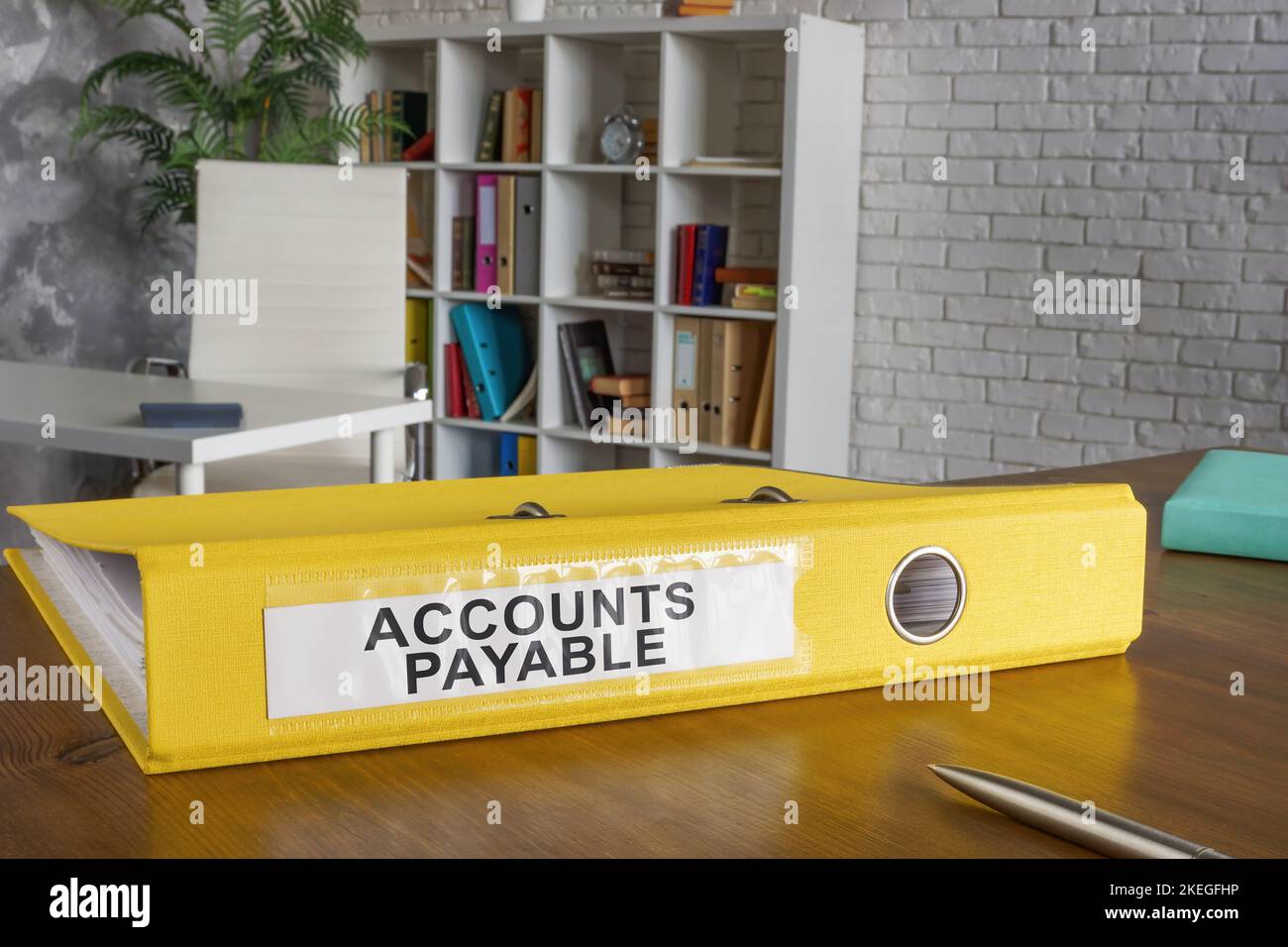 Yellow folder with label accounts payable on the table. Stock Photo