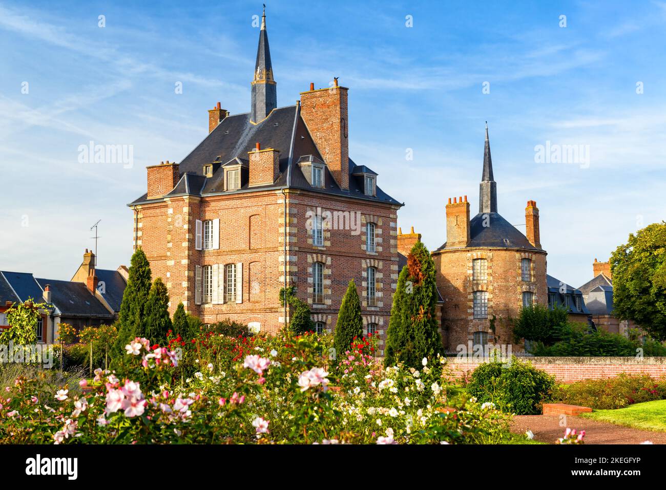 Houses in Loire Valley, France. Scenic view of French chateau and flower garden. Scenery of old mansion like castle in France. Nice rural landscape wi Stock Photo
