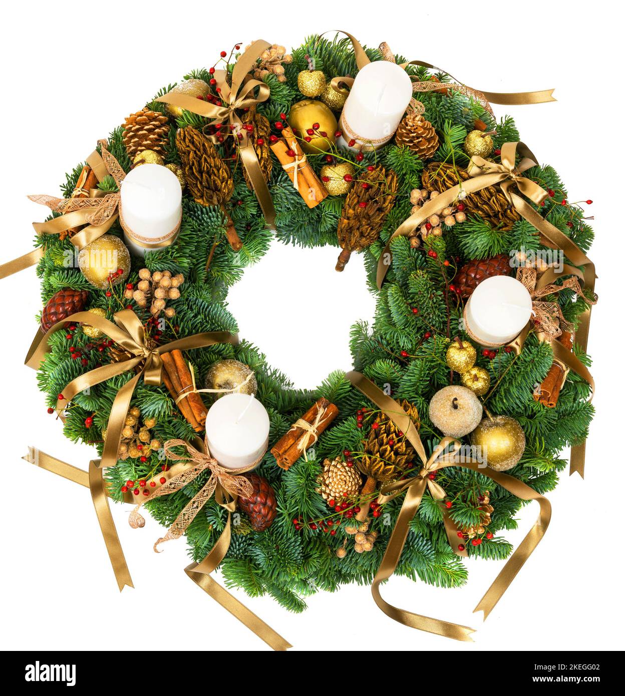 Christmas wreath isolated on white background, top view of New Year composition with candles, pine cones and branch, cinnamon sticks. Luxury decoratio Stock Photo