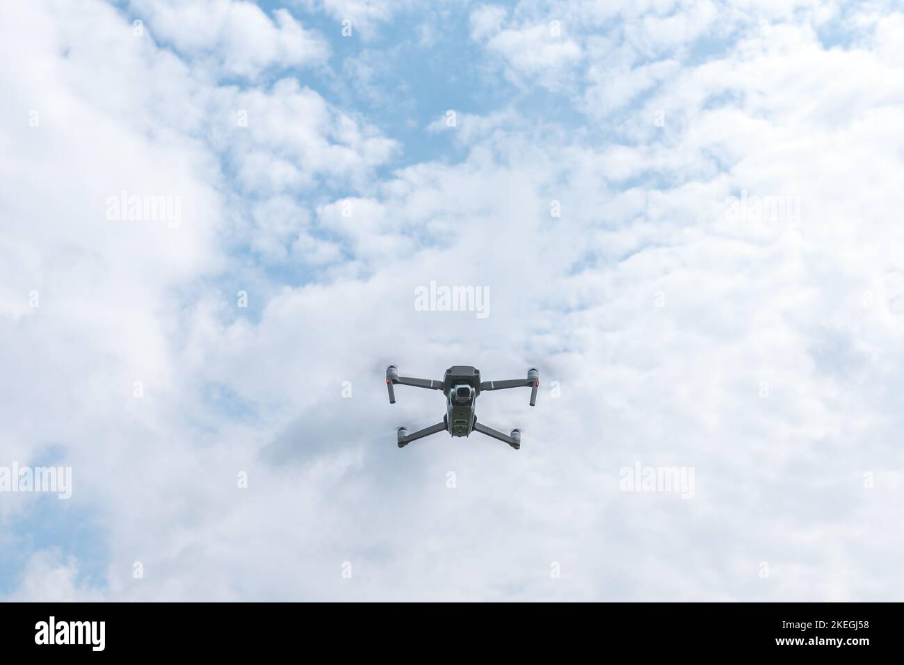 A low-angle shot from a flying unmanned drone under a blue sky and copy ...