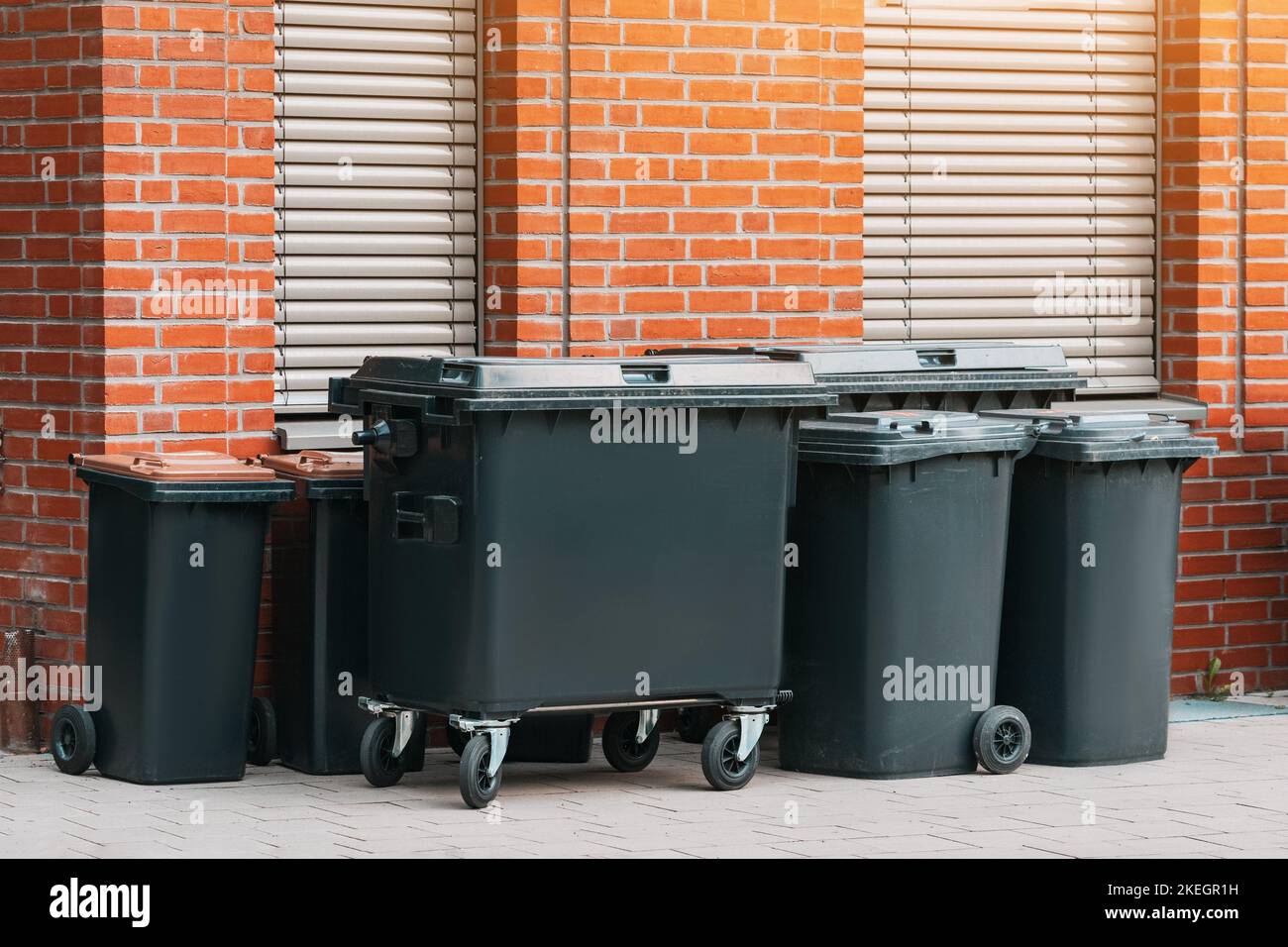 Group of new and clean garbage bins at city street. Trash and rubbish