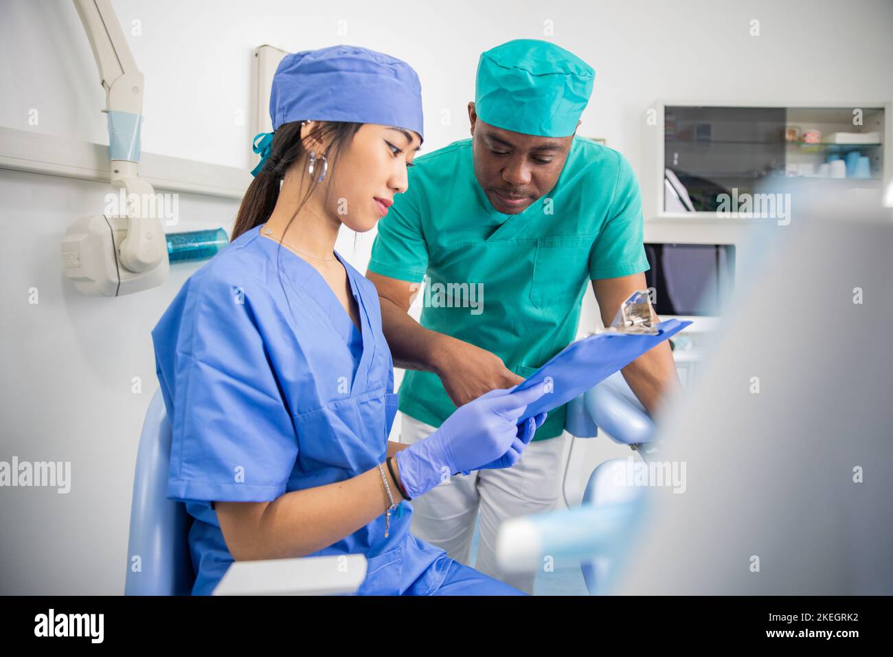 Two colleagues dentists in the dental office, work between doctors. Stock Photo