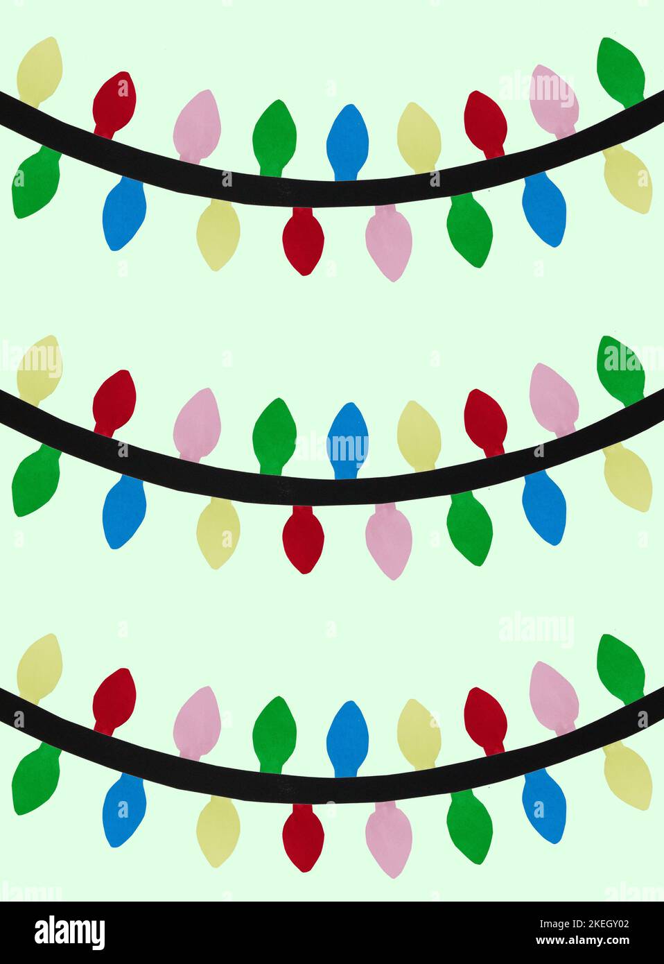 paper colored lights on a green background, creative art holiday concept Stock Photo