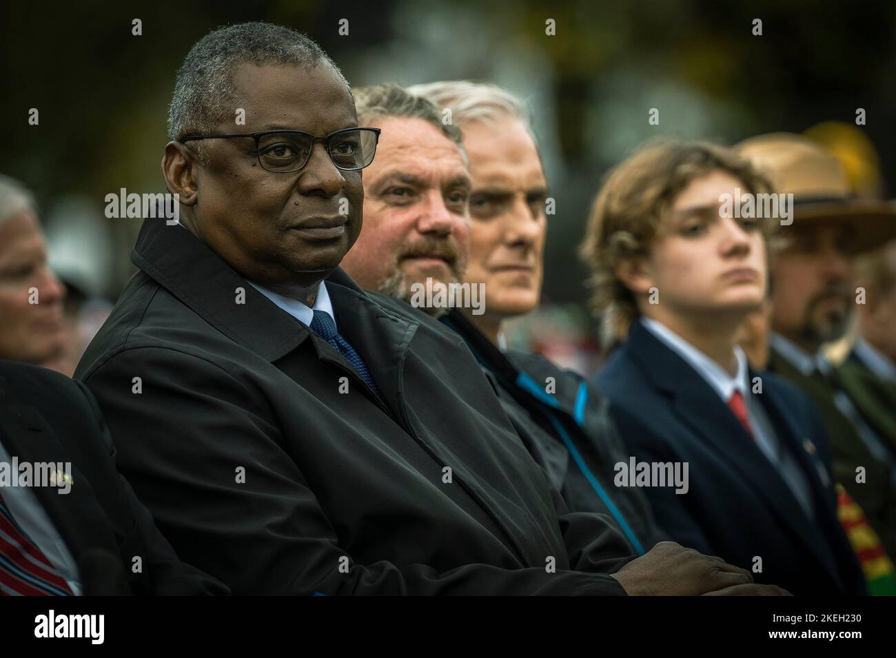 Washington, United States Of America. 11th Nov, 2022. Washington, United States of America. 11 November, 2022. U.S. Secretary of Defense Lloyd J. Austin III, left, sits with Secretary of the Veterans Administration, Denis McDonough, center, during the Veterans Day Observance at the Vietnam Veterans Memorial, November 11, 2022 in Washington, DC The day marked the 40th anniversary of the memorial dedication. Credit: Chad J. McNeeley/DOD Photo/Alamy Live News Stock Photo