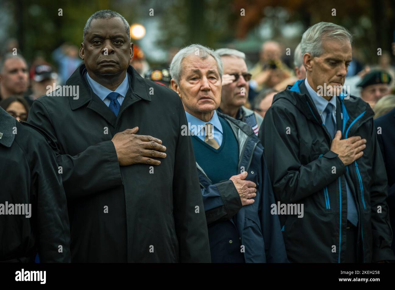 Washington, United States Of America. 11th Nov, 2022. Washington, United States of America. 11 November, 2022. U.S. Secretary of Defense Lloyd J. Austin III, left, stands for the national anthem alongside former Secretary of Defense, Chuck Hagel, center, and Secretary of the Veterans Administration, Denis McDonough during the Veterans Day Observance at the Vietnam Veterans Memorial, November 11, 2022 in Washington, DC The day marked the 40th anniversary of the memorial dedication. Credit: Chad J. McNeeley/DOD Photo/Alamy Live News Stock Photo