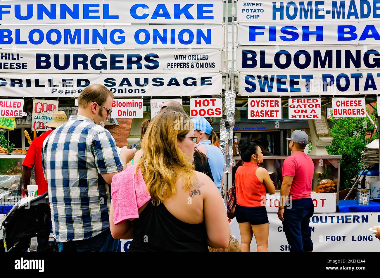 People line up for food from street vendors at the Market Street