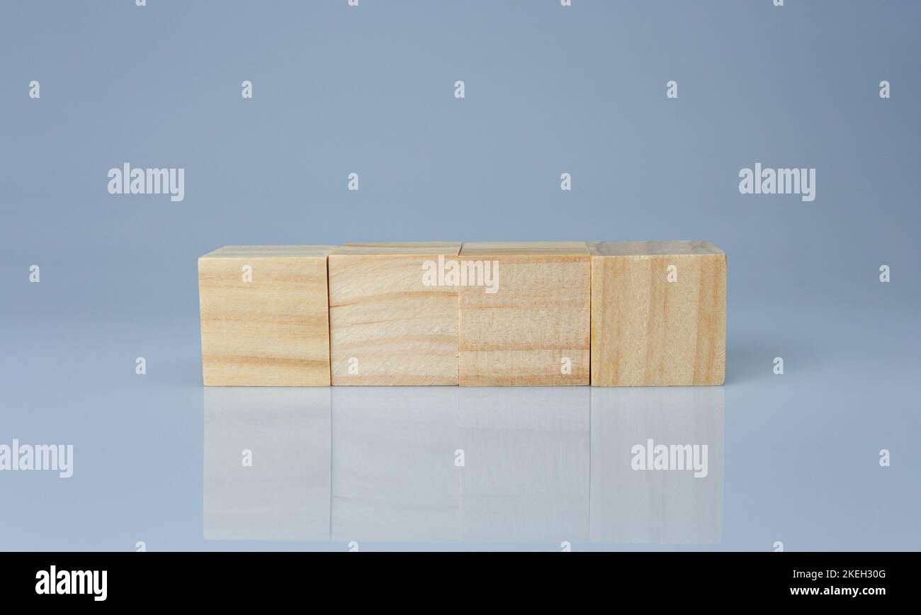 empty wooden blocks lined up on a white background. Business concept ...
