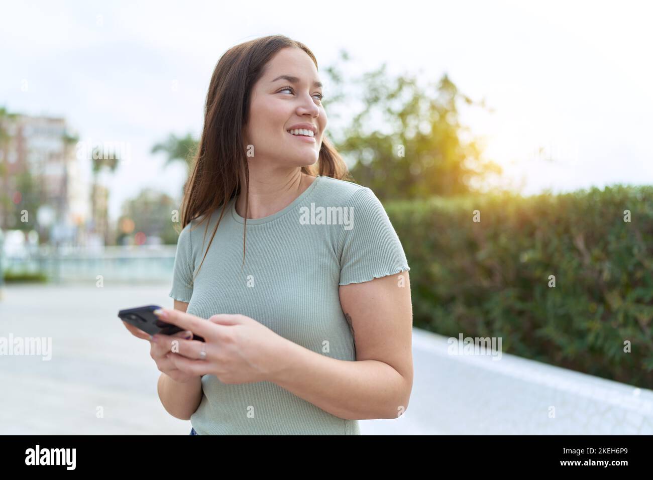 Young beautiful woman smiling confident using smartphone at park Stock ...
