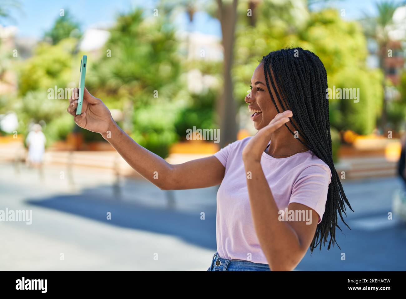 African american woman smiling confident having video call at park ...