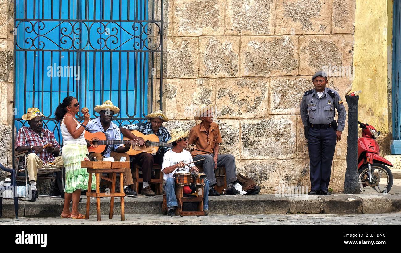 Havana, Cuba - February 2, 2010:  Street musicians play music for tourists in Havana.  Tourism is now Cuba’s main source of income and Cuban's depend Stock Photo