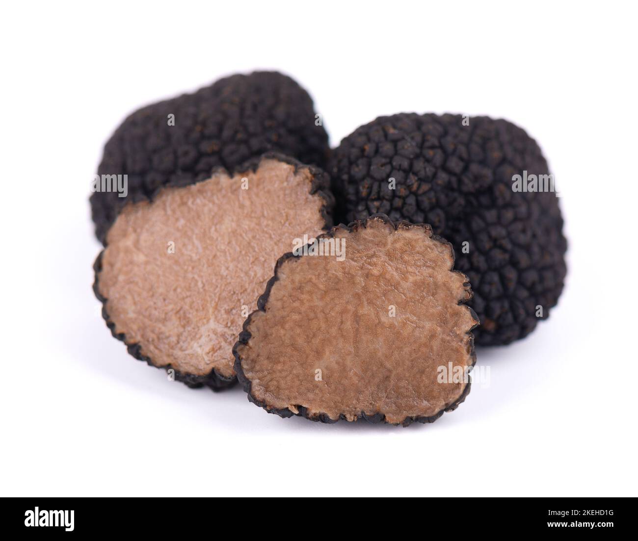 Black truffles isolated on a white background. Fresh sliced truffle