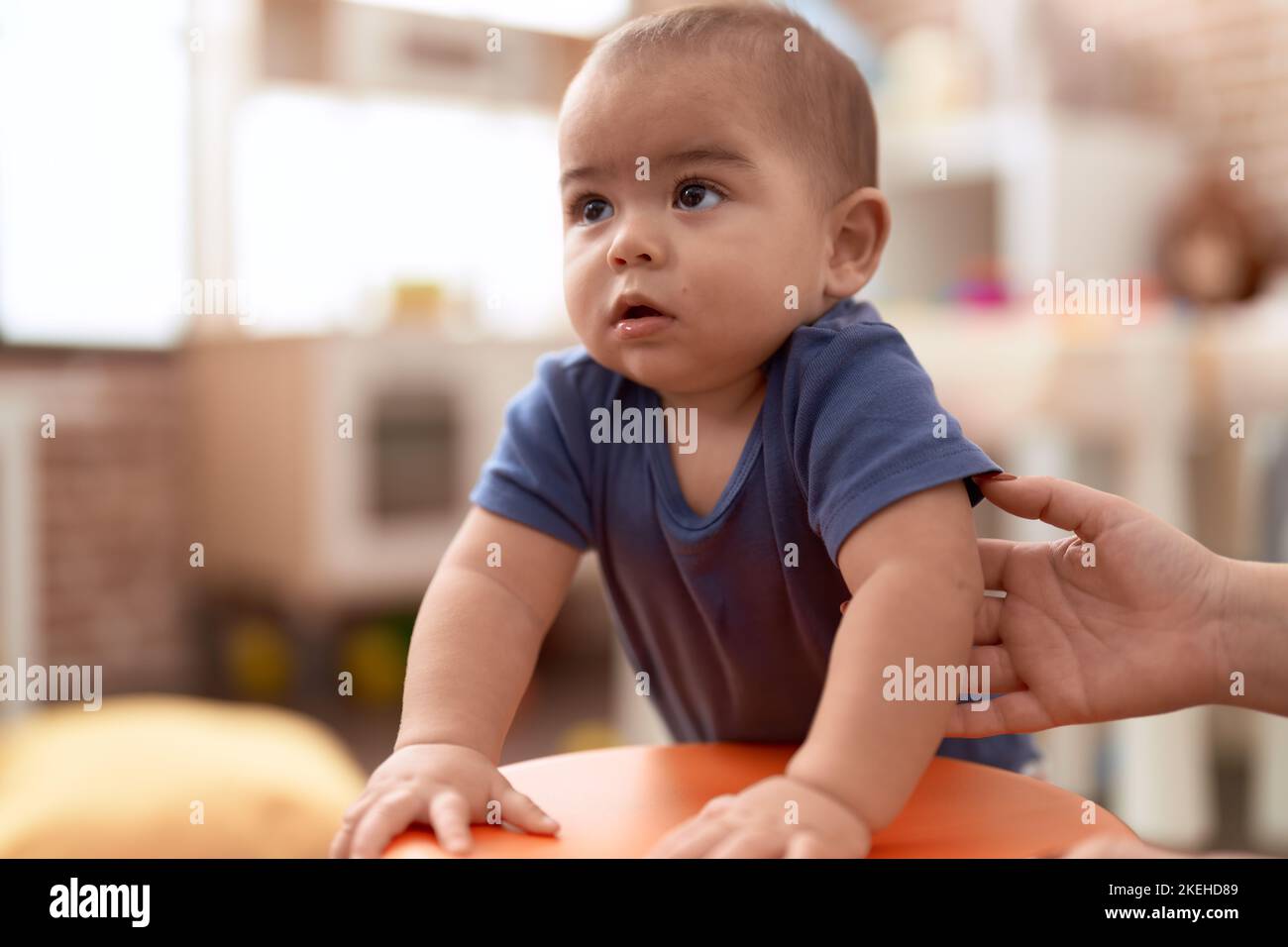 Boy leaning on stool hi-res stock photography and images - Alamy